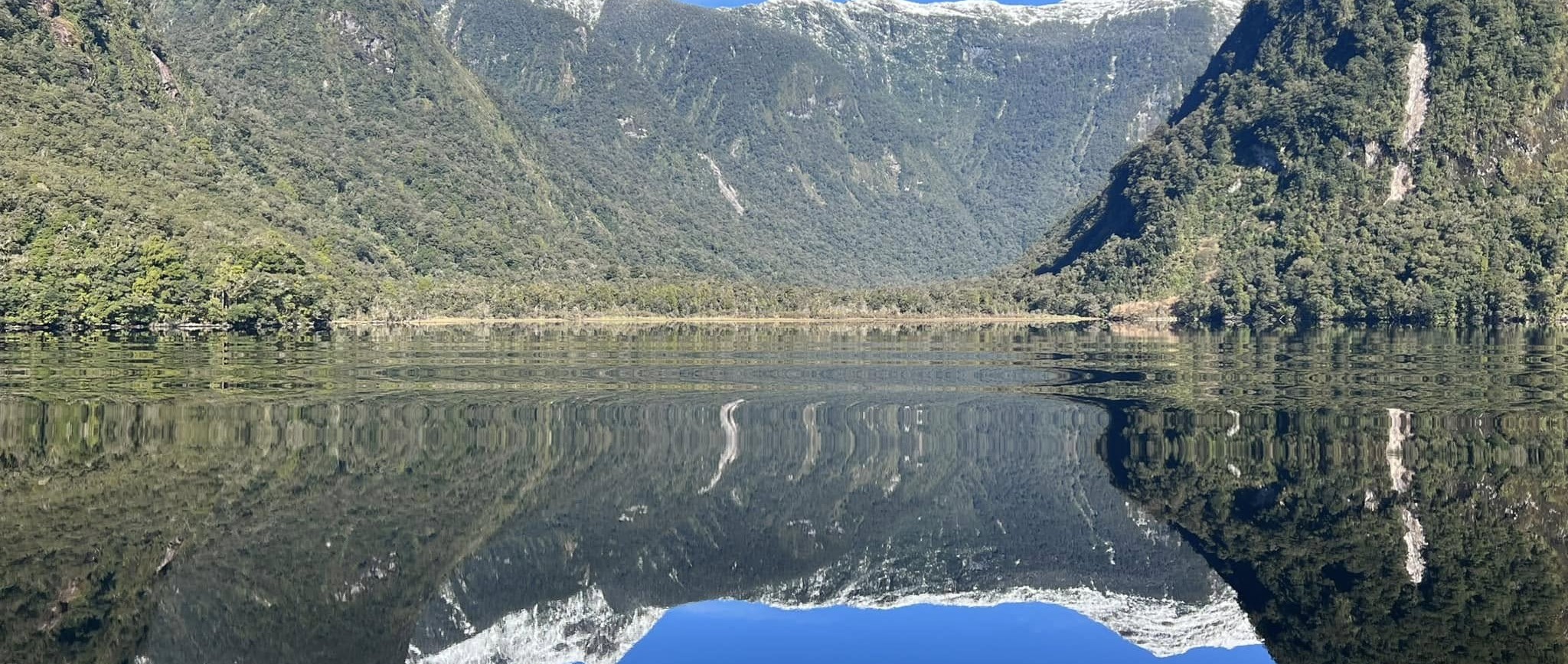 Reflections and snow-capped peaks